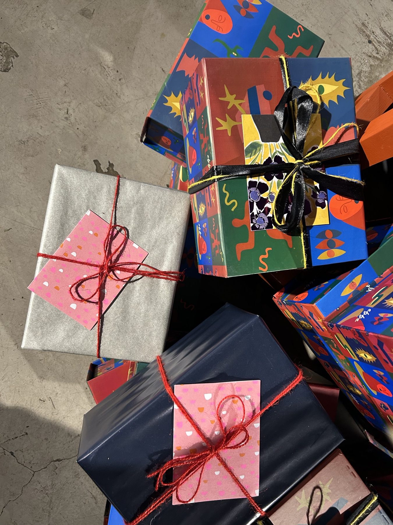 EBBE gift boxes wrapped in paper and red string, ready to give